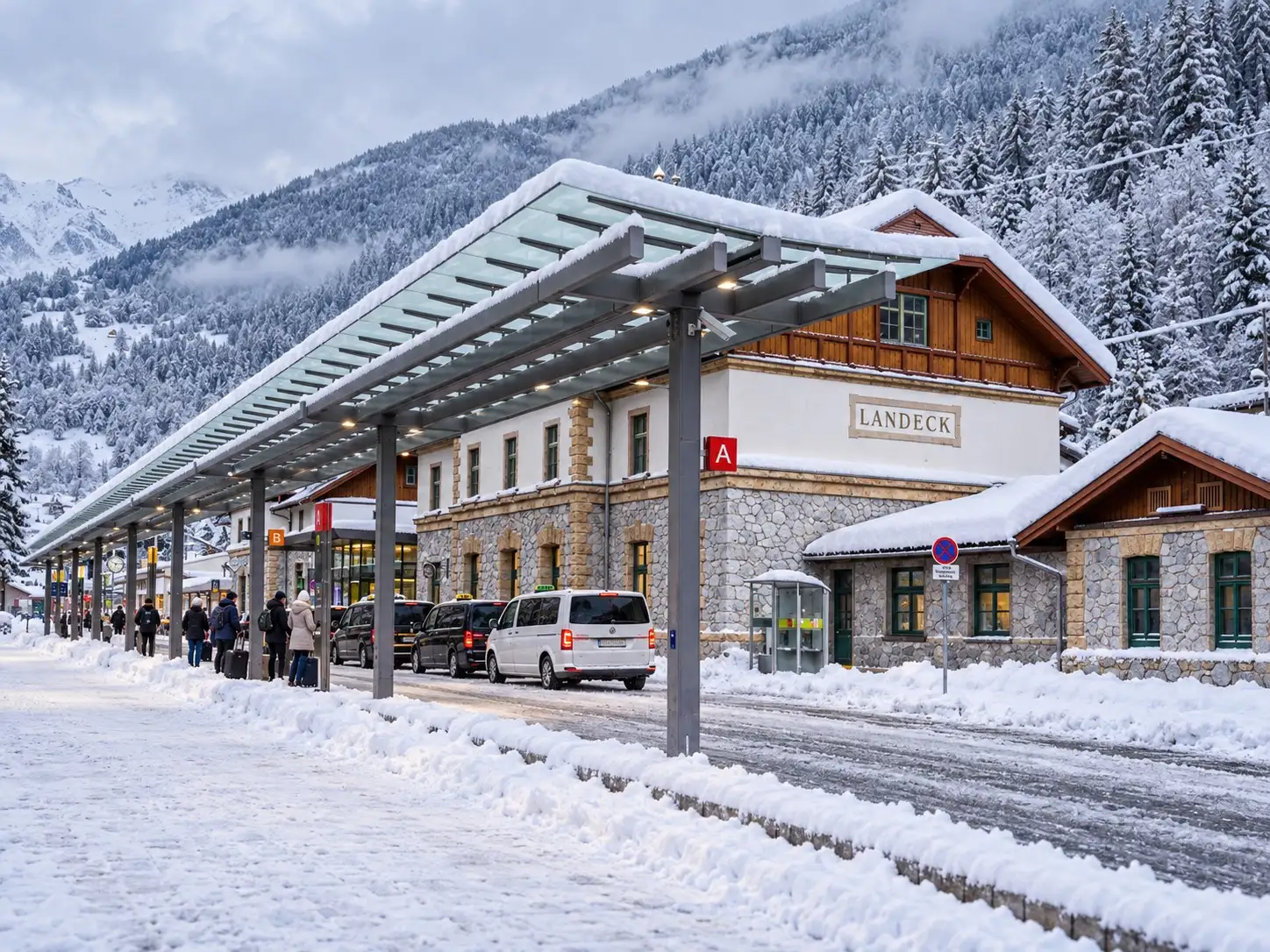 Taxi St. Anton to Zams – pickup at the Landeck-Zams railway station Taxi St. Anton to Zams: white 4×4 minibus taxi of Taxi Anton waiting at the Landeck-Zams railway station in Zams in winter